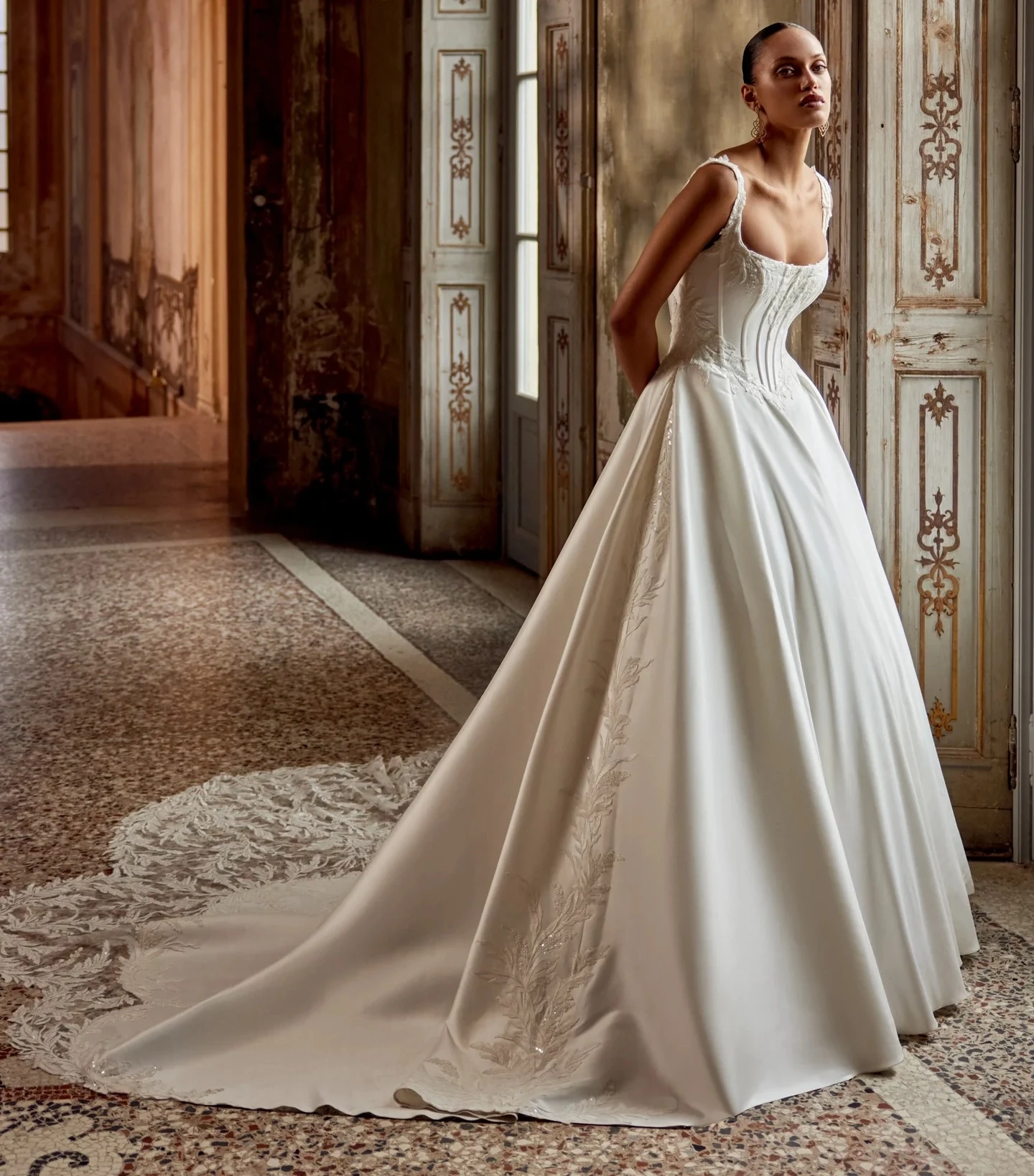 Model wearing a white Justin Alexander Fall 2024 gown